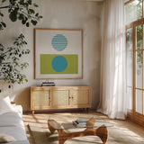 Reflection II Green by Moira Hershey. Shown in a natural wood frame in a cozy modern living room. Available as an archival giclee rolled canvas, fine art paper, or poster print. SKU 72251a.