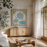 Safari Fun Elephant by Moira Hershey. Shown in a natural wood frame in a cozy modern living room. Available as an archival giclee rolled canvas, fine art paper, or poster print. SKU 19924a.