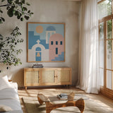 Santorini Summer II Sq by Moira Hershey. Shown in a natural wood frame in a cozy modern living room. Available as an archival giclee rolled canvas, fine art paper, or poster print. SKU 80667a.