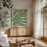 Tropical Treasures I by Moira Hershey. Shown in a natural wood frame in a cozy modern living room. Available as an archival giclee rolled canvas, fine art paper, or poster print. SKU 54941a.