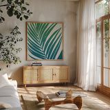 Tropical Treasures III Blue Green by Moira Hershey. Shown in a natural wood frame in a cozy modern living room. Available as an archival giclee rolled canvas, fine art paper, or poster print. SKU 56369a.