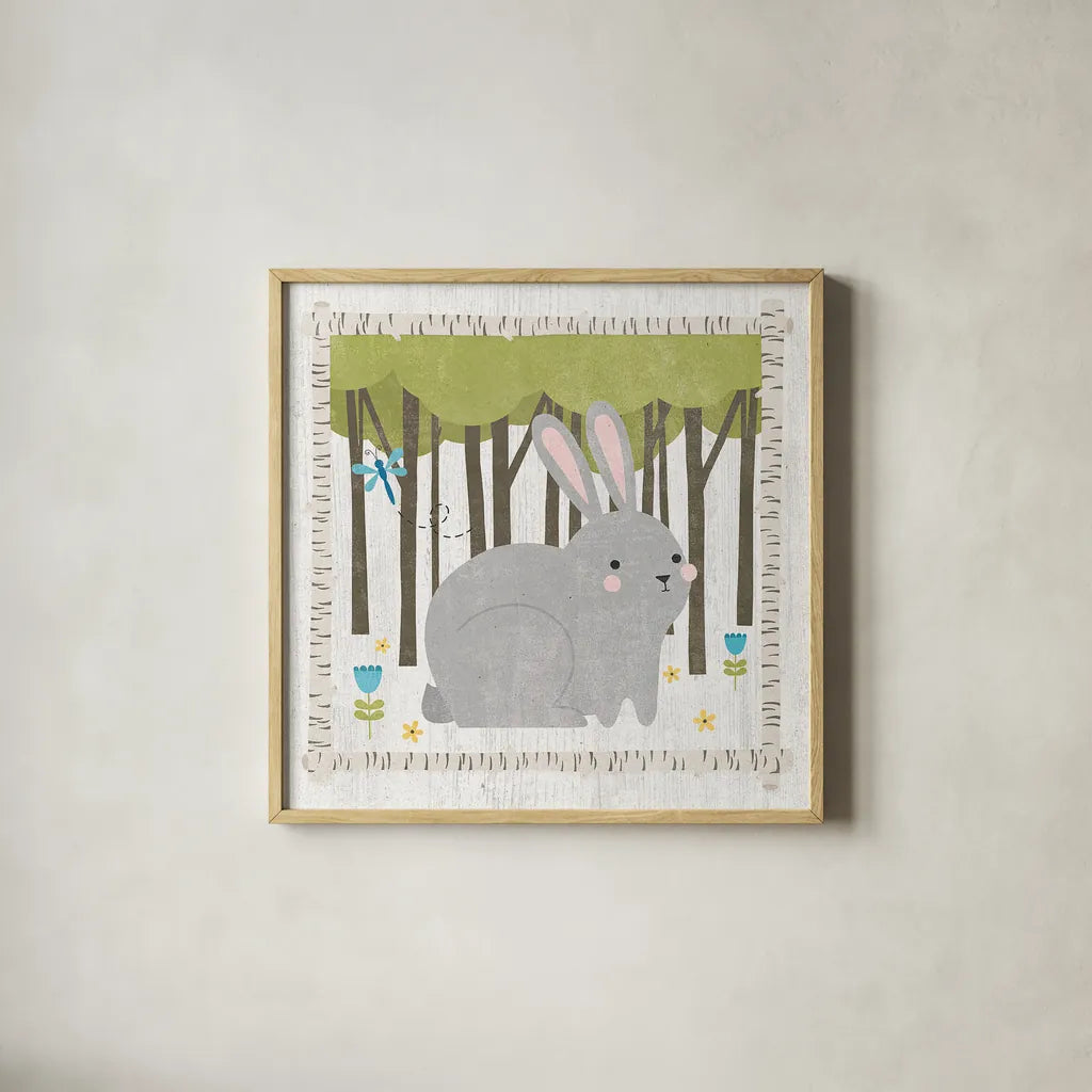 Woodland Hideaway Bunny by Moira Hershey. Shown in a natural wood glass frame for a timeless modern aesthetic. Available as an archival giclee rolled canvas, fine art paper, or poster print. SKU 25587a.