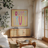 Words of Love III by Moira Hershey. Shown in a natural wood frame in a cozy modern living room. Available as an archival giclee rolled canvas, fine art paper, or poster print. SKU 31358a.