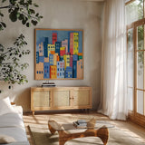 Abstract City View by Morgan Birch. Shown in a natural wood frame in a cozy modern living room. Available as an archival giclee rolled canvas, fine art paper, or poster print. SKU 103146a.