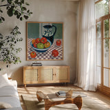 Bowl of Apples by Morgan Birch. Shown in a natural wood frame in a cozy modern living room. Available as an archival giclee rolled canvas, fine art paper, or poster print. SKU 103340a.