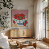 Bowl of Summer Fruit I by Morgan Birch. Shown in a natural wood frame in a cozy modern living room. Available as an archival giclee rolled canvas, fine art paper, or poster print. SKU 104061a.