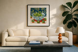Bowl of Summer Fruit II by Morgan Birch. Displayed in a glass frame with matte in a clean modern living room. Available as an archival giclee rolled canvas, fine art paper, or poster print. SKU 104062a.