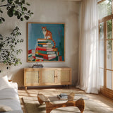Cat on Book Stack by Morgan Birch. Shown in a natural wood frame in a cozy modern living room. Available as an archival giclee rolled canvas, fine art paper, or poster print. SKU 103140a.