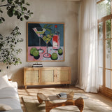 Cocktail Two Ways by Morgan Birch. Shown in a natural wood frame in a cozy modern living room. Available as an archival giclee rolled canvas, fine art paper, or poster print. SKU 103135a.