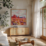 Desert in Bloom by Morgan Birch. Shown in a natural wood frame in a cozy modern living room. Available as an archival giclee rolled canvas, fine art paper, or poster print. SKU 103144a.