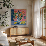 Flower Still Life With Lemons by Morgan Birch. Shown in a natural wood frame in a cozy modern living room. Available as an archival giclee rolled canvas, fine art paper, or poster print. SKU 104011a.