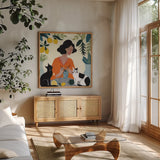 Knitting With Cats by Morgan Birch. Shown in a natural wood frame in a cozy modern living room. Available as an archival giclee rolled canvas, fine art paper, or poster print. SKU 103118a.