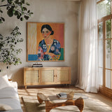 Woman With Patterned Shirt by Morgan Birch. Shown in a natural wood frame in a cozy modern living room. Available as an archival giclee rolled canvas, fine art paper, or poster print. SKU 103113a.