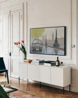 Along the Thames v.2 by Myles Sullivan. shown as a framed stretched canvas in a living room above a console. Available as a archival giclee rolled canvas, fine art paper, or poster print. SKU 22345i.