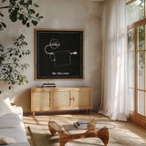 Home Improvement IV Black by Myles Sullivan. Shown in a natural wood frame in a cozy modern living room. Available as an archival giclee rolled canvas, fine art paper, or poster print. SKU 58126a.
