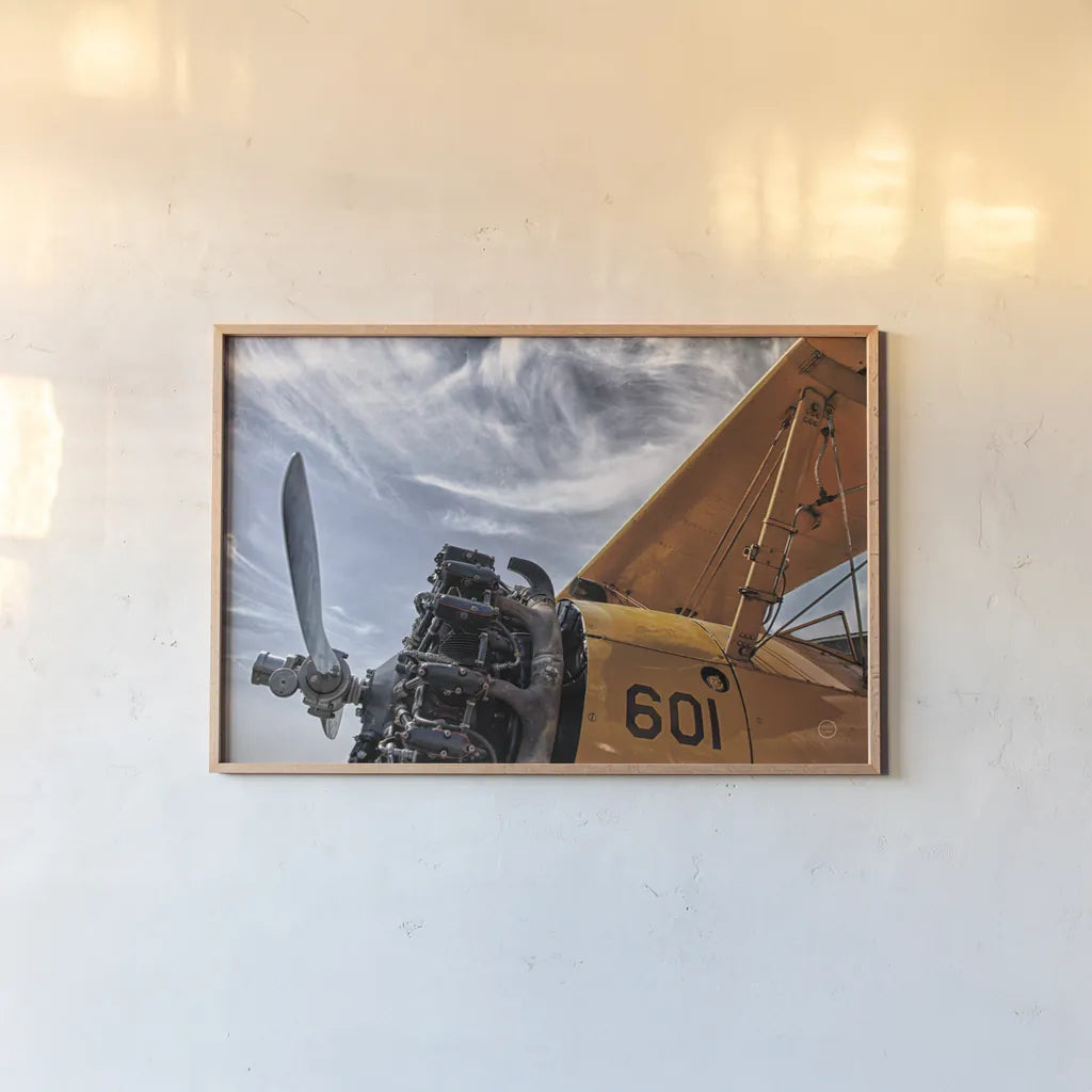 Aero Maquina Big Yellow by Nathan Larson. shown as a paper print in a natural frame. Available as a archival giclee rolled canvas, fine art paper, or poster print. SKU 73109i.