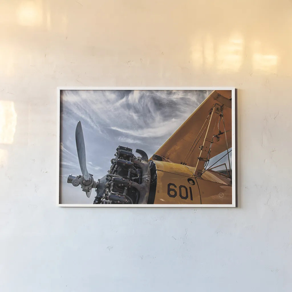 Aero Maquina Big Yellow by Nathan Larson. shown as a paper print in a white frame. Available as a archival giclee rolled canvas, fine art paper, or poster print. SKU 73109i.