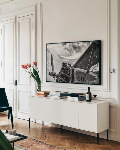 Aero Maquina Big Yellow BW by Nathan Larson. shown as a framed stretched canvas in a living room above a console. Available as a archival giclee rolled canvas, fine art paper, or poster print. SKU 73110i.