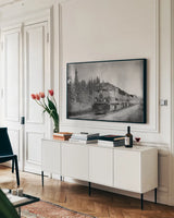 Alaskan Train by Nathan Larson. shown as a framed stretched canvas in a living room above a console. Available as a archival giclee rolled canvas, fine art paper, or poster print. SKU 94125i.