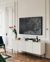 Alberta Black Bear BW by Nathan Larson. shown as a framed stretched canvas in a living room above a console. Available as a archival giclee rolled canvas, fine art paper, or poster print. SKU 100751i.