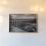 Aqueduct IV by Nathan Larson. shown as a paper print in a natural frame. Available as a archival giclee rolled canvas, fine art paper, or poster print. SKU 89237i.
