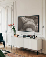 Arch Angles I BW by Nathan Larson. shown as a framed stretched canvas in a living room above a console. Available as a archival giclee rolled canvas, fine art paper, or poster print. SKU 87728i.