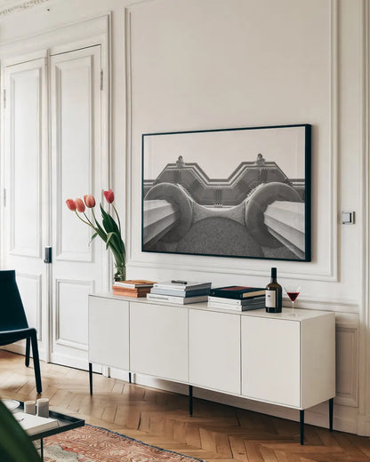 Arch Angles II BW by Nathan Larson. shown as a framed stretched canvas in a living room above a console. Available as a archival giclee rolled canvas, fine art paper, or poster print. SKU 87729i.