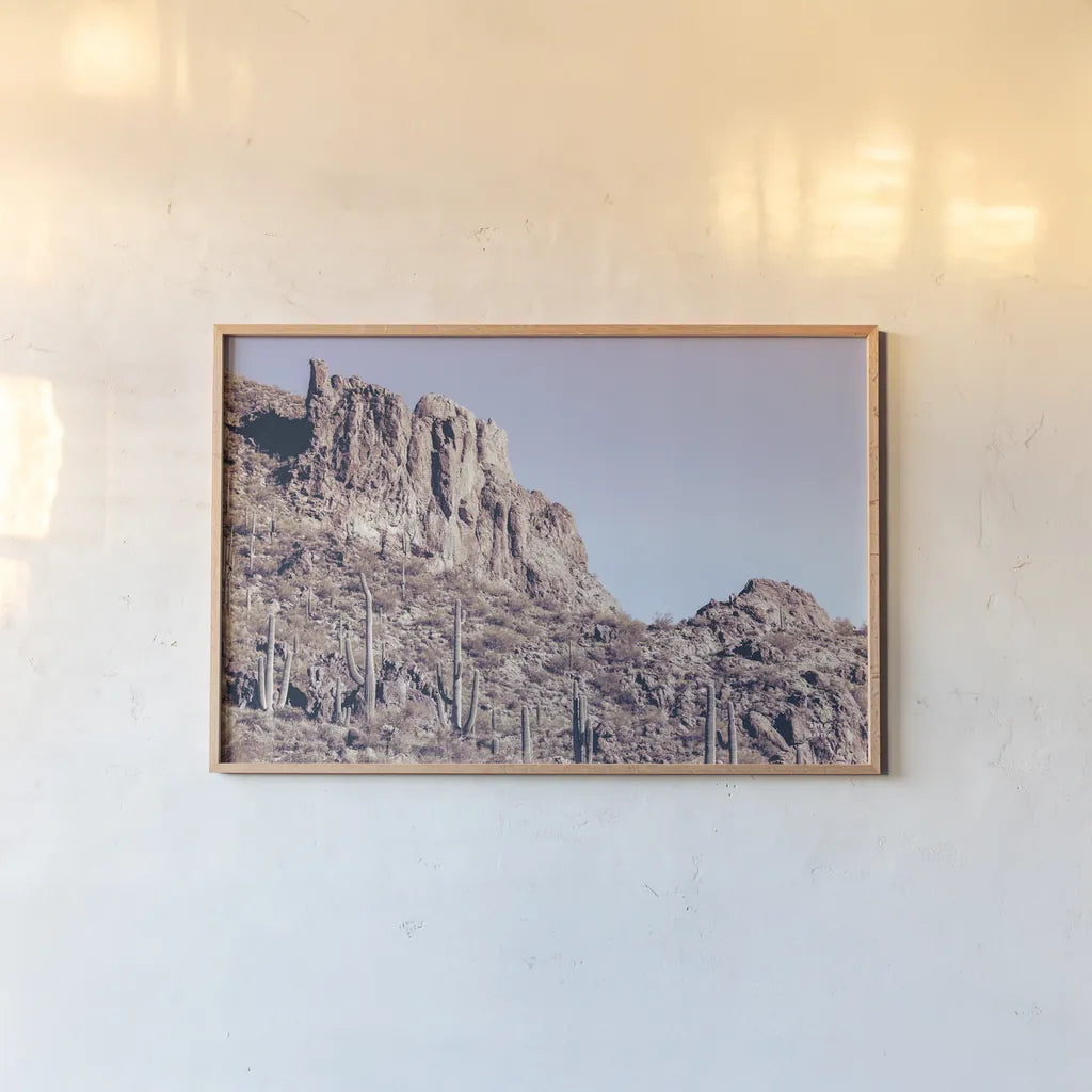 Arizona Dreams by Nathan Larson. shown as a paper print in a natural frame. Available as a archival giclee rolled canvas, fine art paper, or poster print. SKU 90479i.