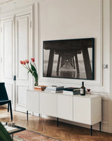 Atlantic Ocean Pier by Nathan Larson. shown as a framed stretched canvas in a living room above a console. Available as a archival giclee rolled canvas, fine art paper, or poster print. SKU 97451i.