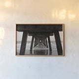 Atlantic Ocean Pier by Nathan Larson. shown as a paper print in a natural frame. Available as a archival giclee rolled canvas, fine art paper, or poster print. SKU 97451i.