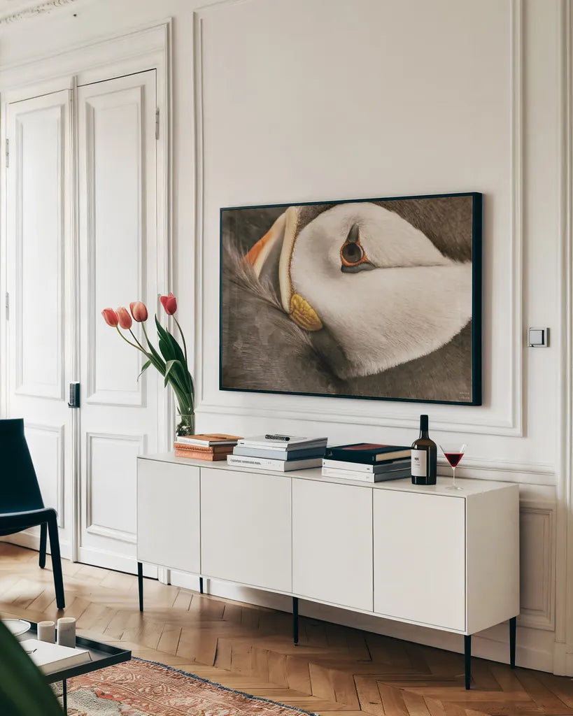 Atlantic Puffin Tucked Neutral by Nathan Larson. shown as a framed stretched canvas in a living room above a console. Available as a archival giclee rolled canvas, fine art paper, or poster print. SKU 100612i.