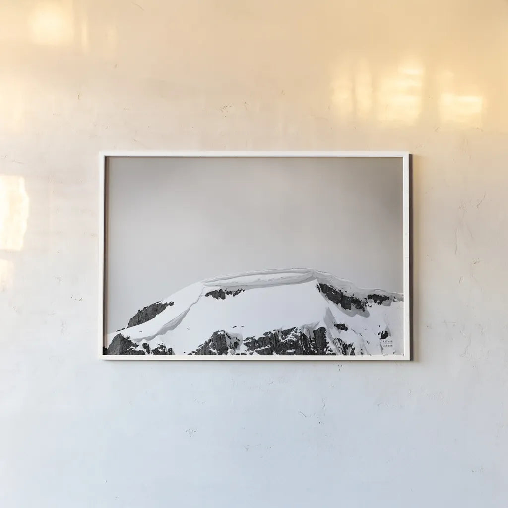 Avalanche View by Nathan Larson. shown as a paper print in a white frame. Available as a archival giclee rolled canvas, fine art paper, or poster print. SKU 81190i.