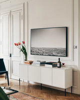 Badland Expanse by Nathan Larson. shown as a framed stretched canvas in a living room above a console. Available as a archival giclee rolled canvas, fine art paper, or poster print. SKU 80631i.
