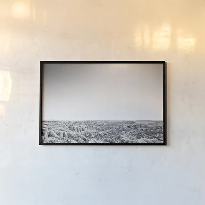 Badland Expanse by Nathan Larson. shown as a paper print in a black flame. Available as a archival giclee rolled canvas, fine art paper, or poster print. SKU 80631i.