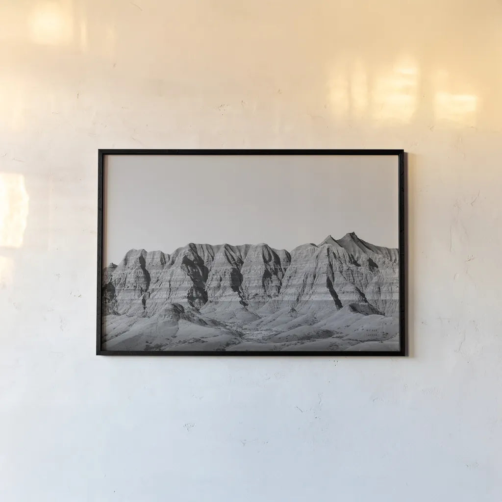 Badlands BW Crop by Nathan Larson. shown as a paper print in a black flame. Available as a archival giclee rolled canvas, fine art paper, or poster print. SKU 77273i.