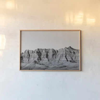Badlands BW Crop by Nathan Larson. shown as a paper print in a natural frame. Available as a archival giclee rolled canvas, fine art paper, or poster print. SKU 77273i.