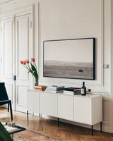Badlands Guard by Nathan Larson. shown as a framed stretched canvas in a living room above a console. Available as a archival giclee rolled canvas, fine art paper, or poster print. SKU 79099i.
