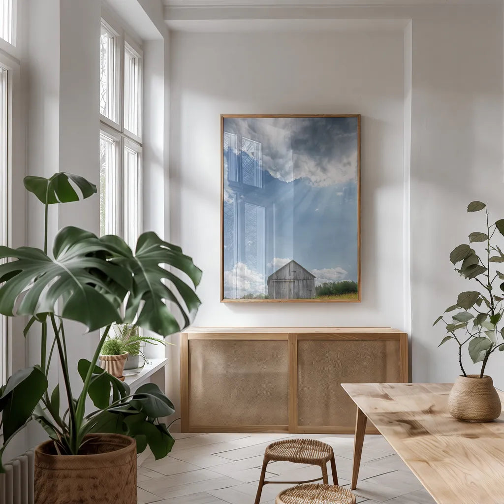 Barn Rays by Nathan Larson. shown as a print in a natural wood frame in a dining room. Available as a archival giclee rolled canvas, fine art paper, or poster print. SKU 80449h.