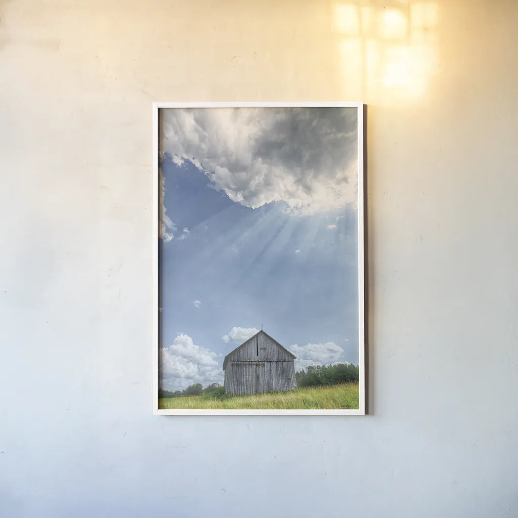 Barn Rays by Nathan Larson. shown as a paper print in a white frame. Available as a archival giclee rolled canvas, fine art paper, or poster print. SKU 80449h.