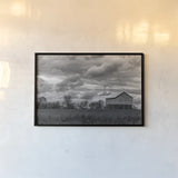 Barn Storms by Nathan Larson. shown as a paper print in a black flame. Available as a archival giclee rolled canvas, fine art paper, or poster print. SKU 98027i.
