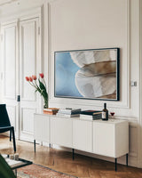 Barred Owl Wing Tip by Nathan Larson. shown as a framed stretched canvas in a living room above a console. Available as a archival giclee rolled canvas, fine art paper, or poster print. SKU 74415i.