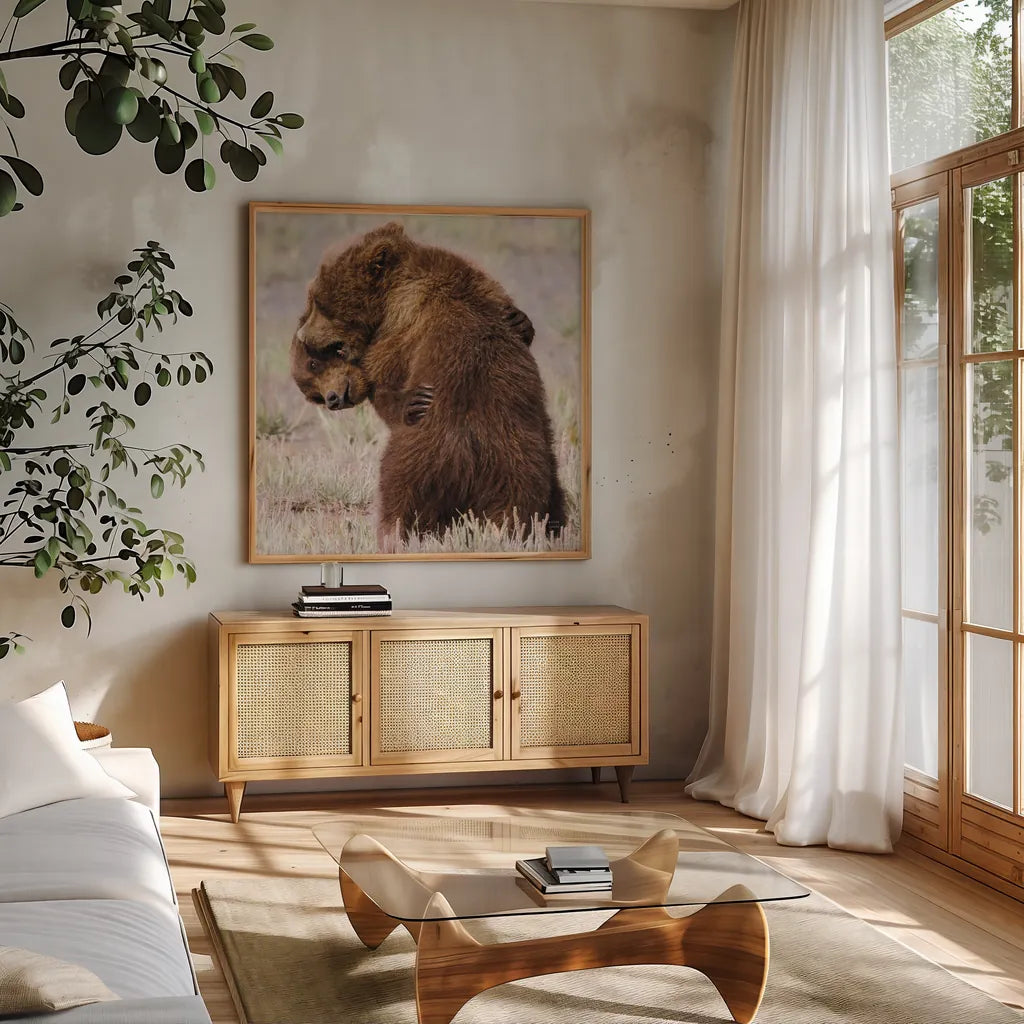 Bear Hug by Nathan Larson. Shown in a natural wood frame in a cozy modern living room. Available as an archival giclee rolled canvas, fine art paper, or poster print. SKU 100763a.