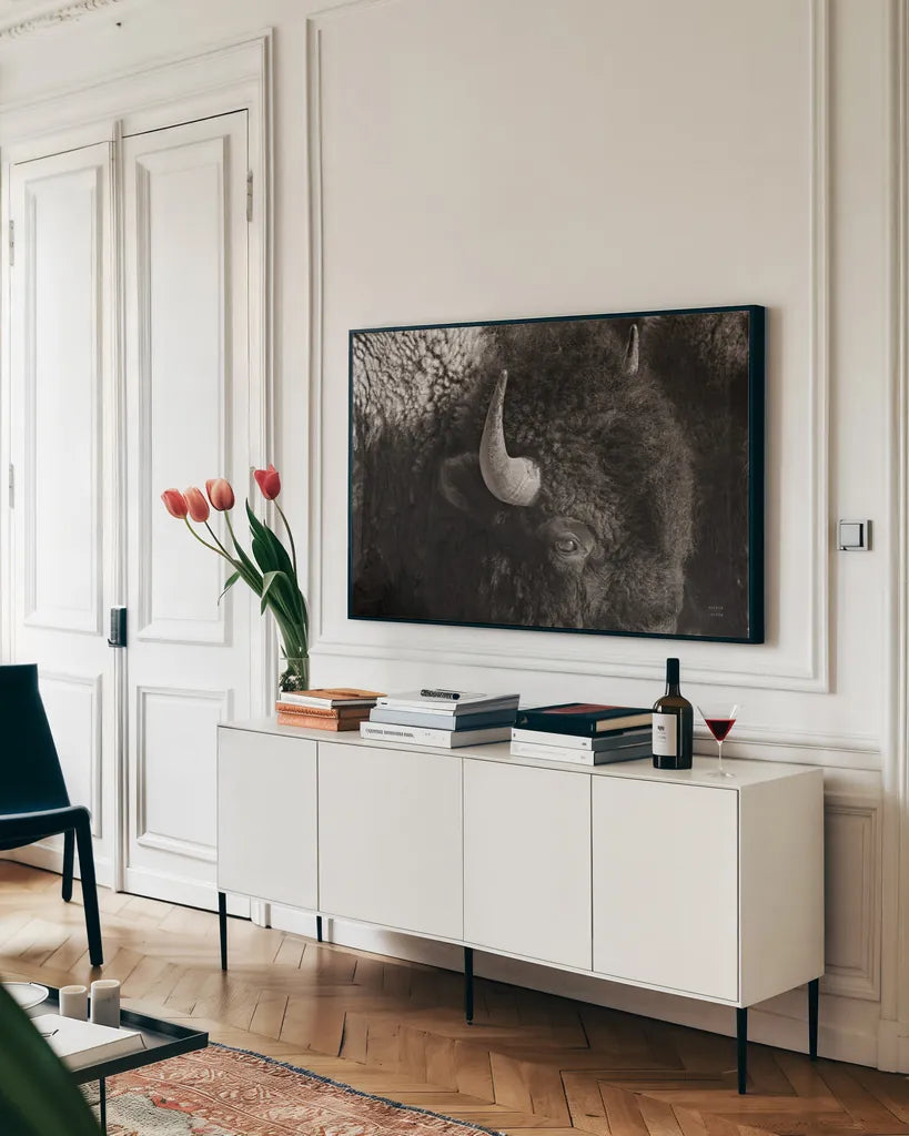 Bison BW by Nathan Larson. shown as a framed stretched canvas in a living room above a console. Available as a archival giclee rolled canvas, fine art paper, or poster print. SKU 84260i.