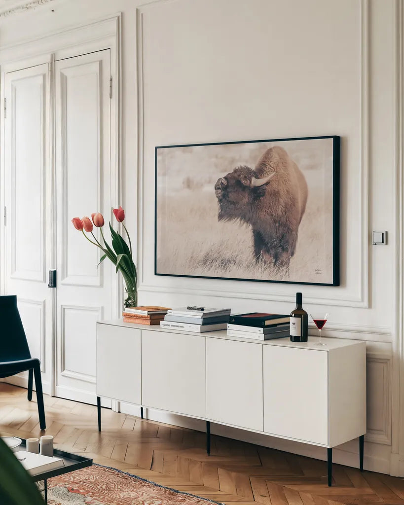 Bison Call by Nathan Larson. shown as a framed stretched canvas in a living room above a console. Available as a archival giclee rolled canvas, fine art paper, or poster print. SKU 84257i.