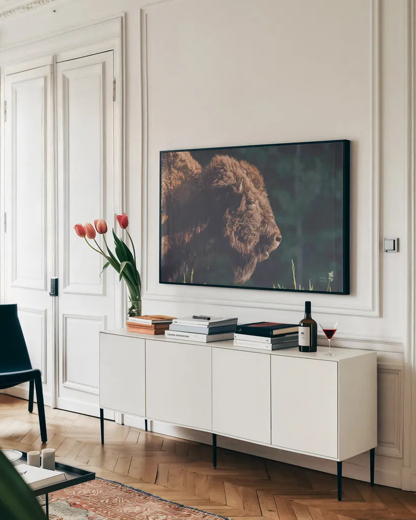 Bison Meditation by Nathan Larson. shown as a framed stretched canvas in a living room above a console. Available as a archival giclee rolled canvas, fine art paper, or poster print. SKU 92725i.
