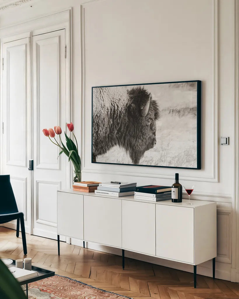 Bison Profile BW by Nathan Larson. shown as a framed stretched canvas in a living room above a console. Available as a archival giclee rolled canvas, fine art paper, or poster print. SKU 84256i.