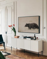 Black Bear in British Columbia by Nathan Larson. shown as a framed stretched canvas in a living room above a console. Available as a archival giclee rolled canvas, fine art paper, or poster print. SKU 93387i.