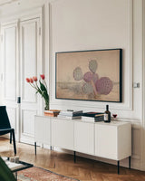 Border Sunset II by Nathan Larson. shown as a framed stretched canvas in a living room above a console. Available as a archival giclee rolled canvas, fine art paper, or poster print. SKU 102777i.