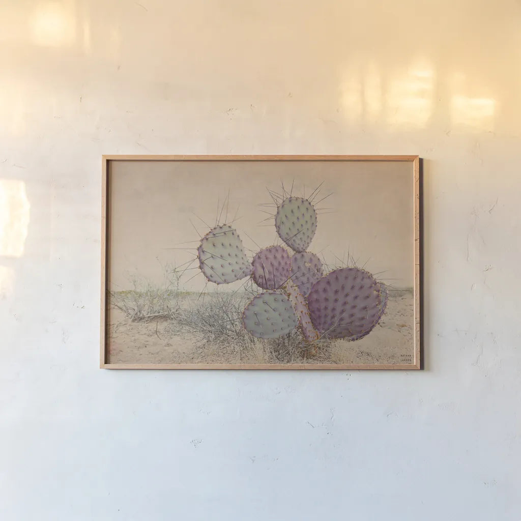 Border Sunset II by Nathan Larson. shown as a paper print in a natural frame. Available as a archival giclee rolled canvas, fine art paper, or poster print. SKU 102777i.