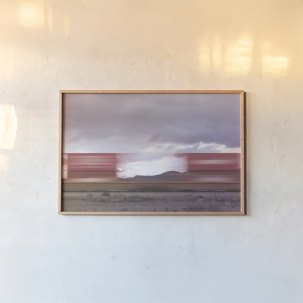 Boxcars by Nathan Larson. shown as a paper print in a natural frame. Available as a archival giclee rolled canvas, fine art paper, or poster print. SKU 96627i.